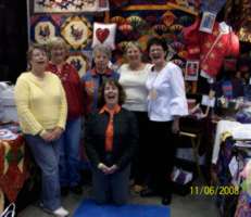 Shoppers in Elaine's booth in Minneapolis.  Notice that one lady was trying on the Weekender Jacket!